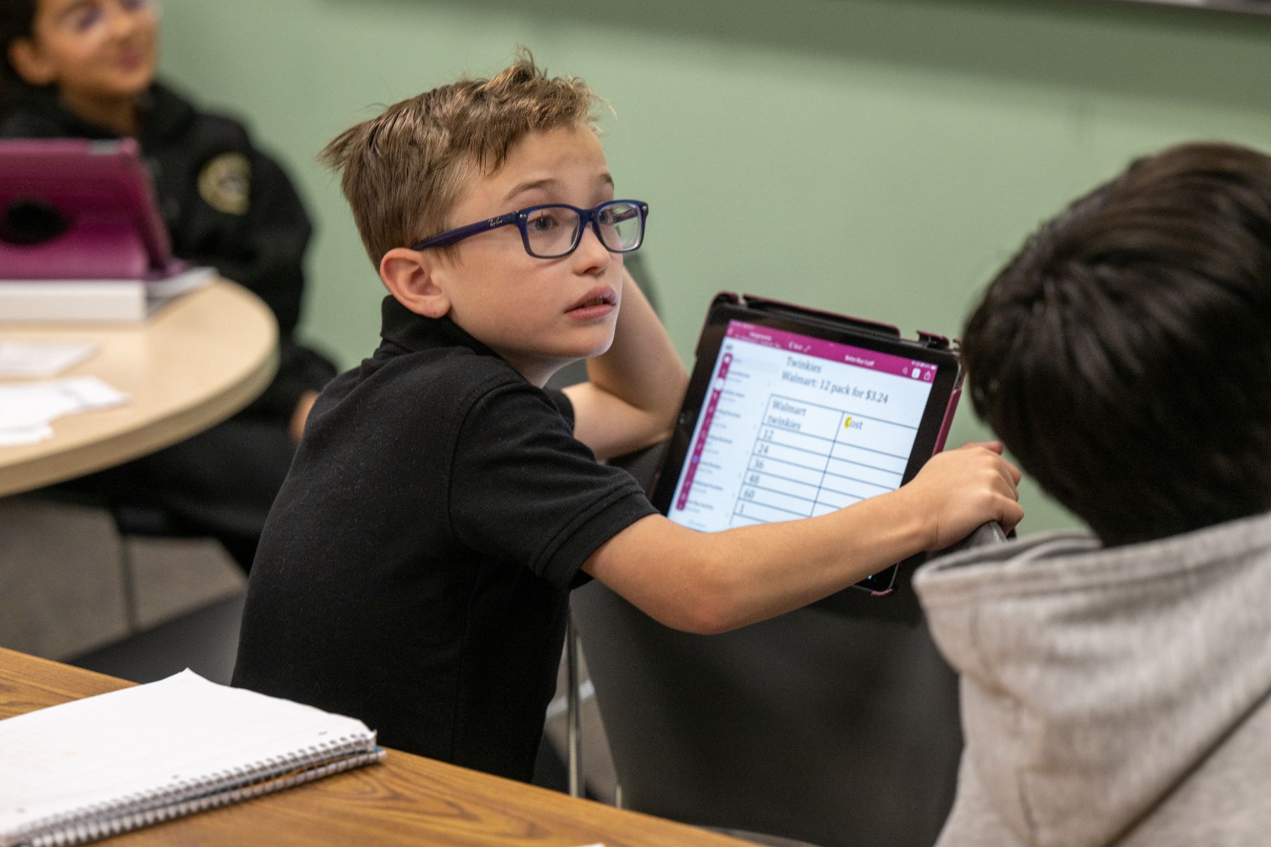 Beehive student working on an iPad in class